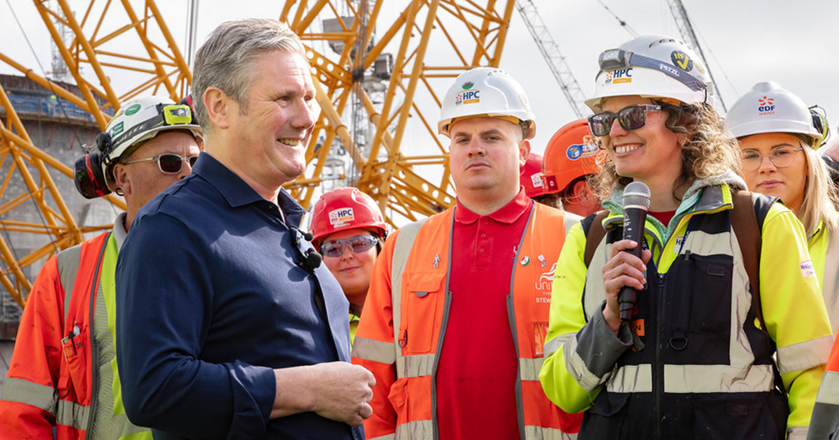Member of Parliament visiting a UK infrastructure construction project with site workers.