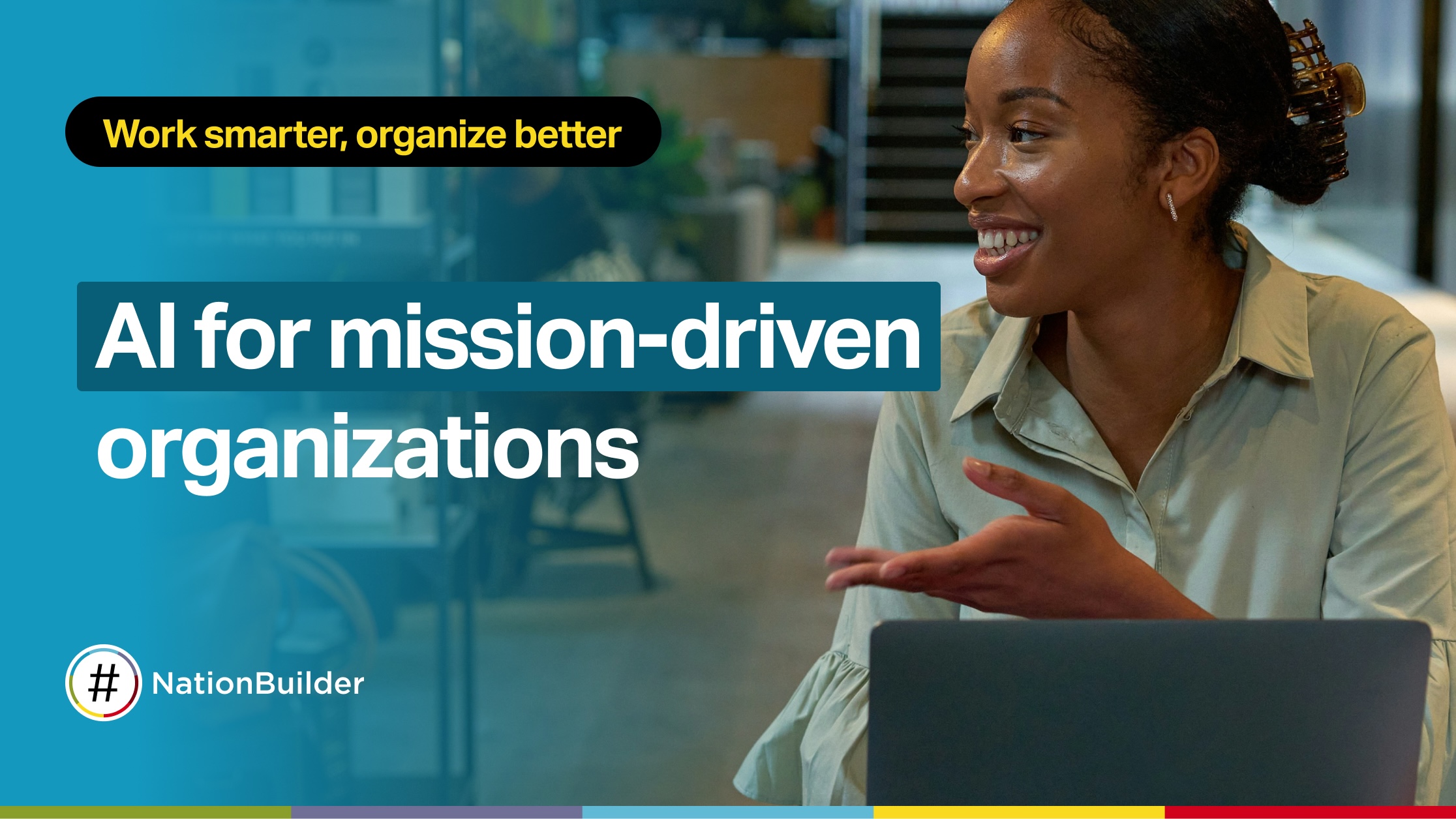 A woman smiling and gesturing while working on a laptop, representing AI tools for mission-driven organizations.