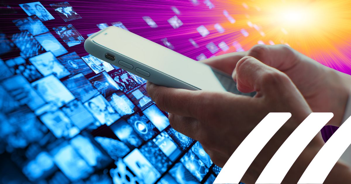 Person using a phone in front of digital imagery