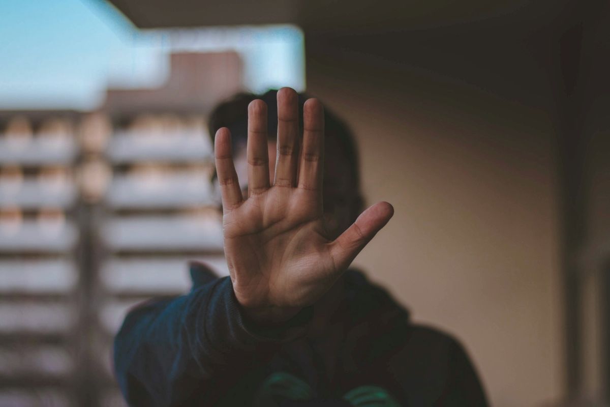 Person with raised hand in 