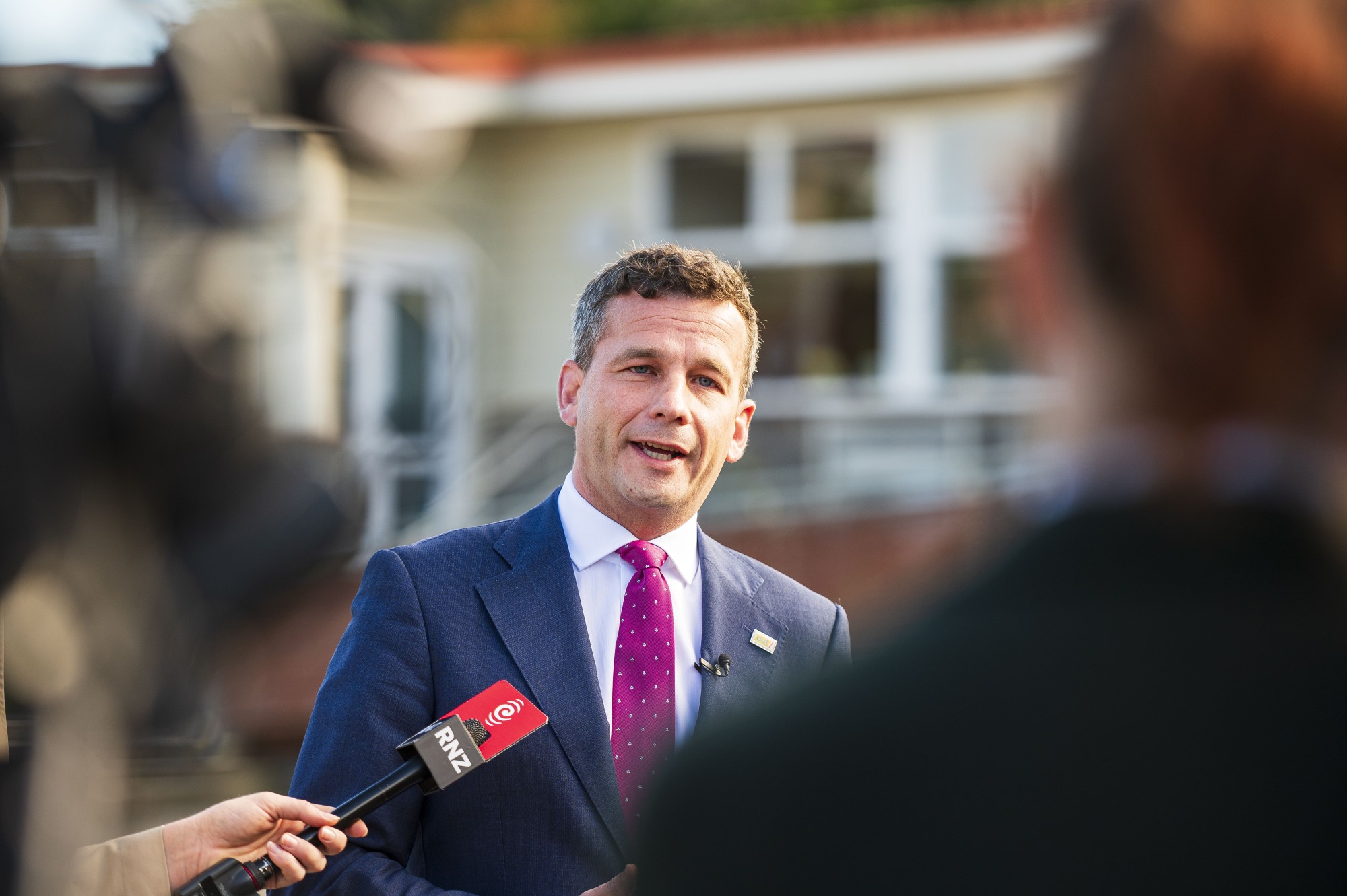 David speaking to reporters
