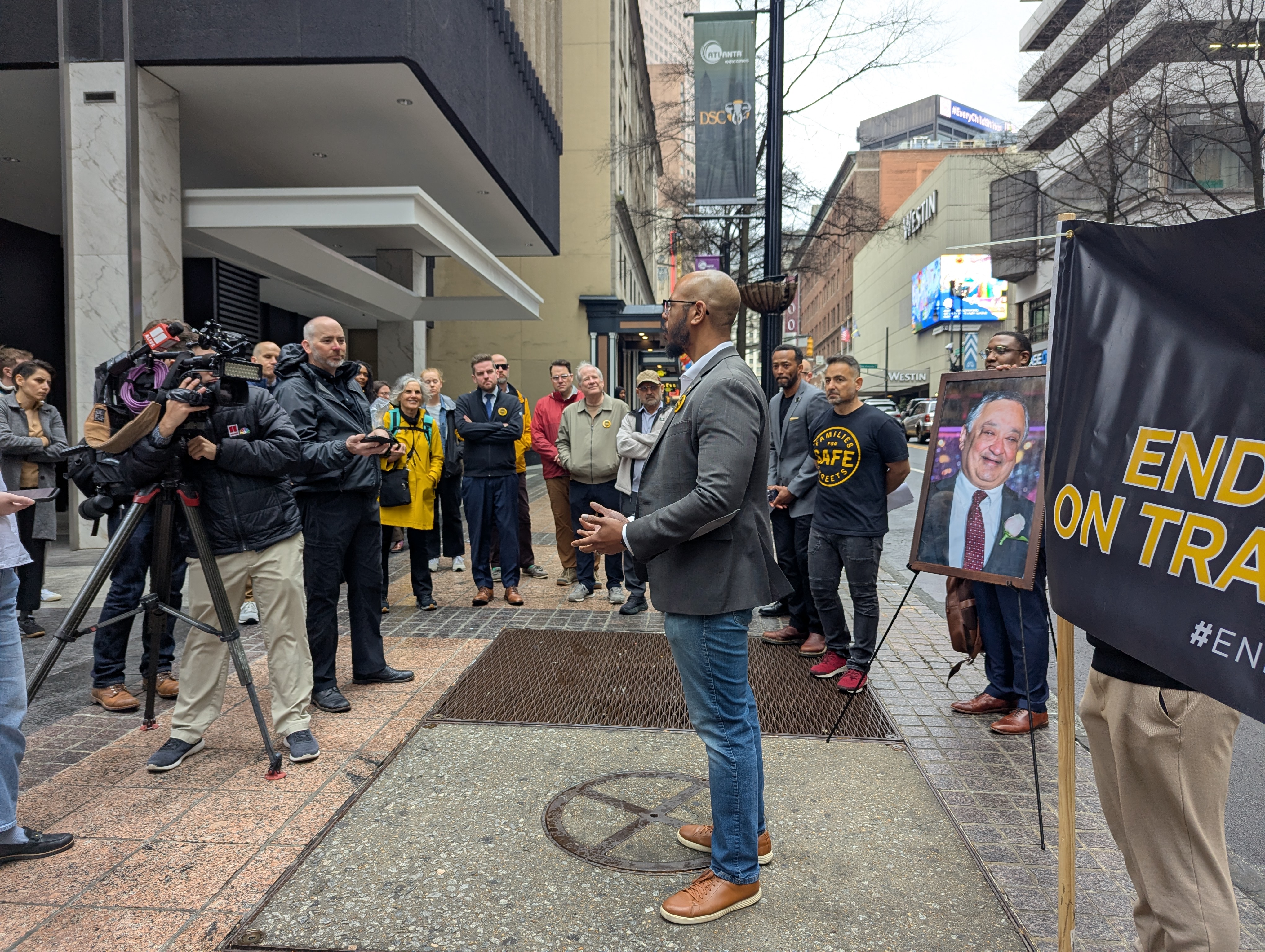 District 4 City Councilmember Jason Dozier (center) addresses media representatives and supporters at the February press conference while Councilmember Matt Westmoreland., family members and advocates look on.