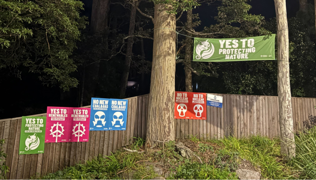 Signs on a busy highway.