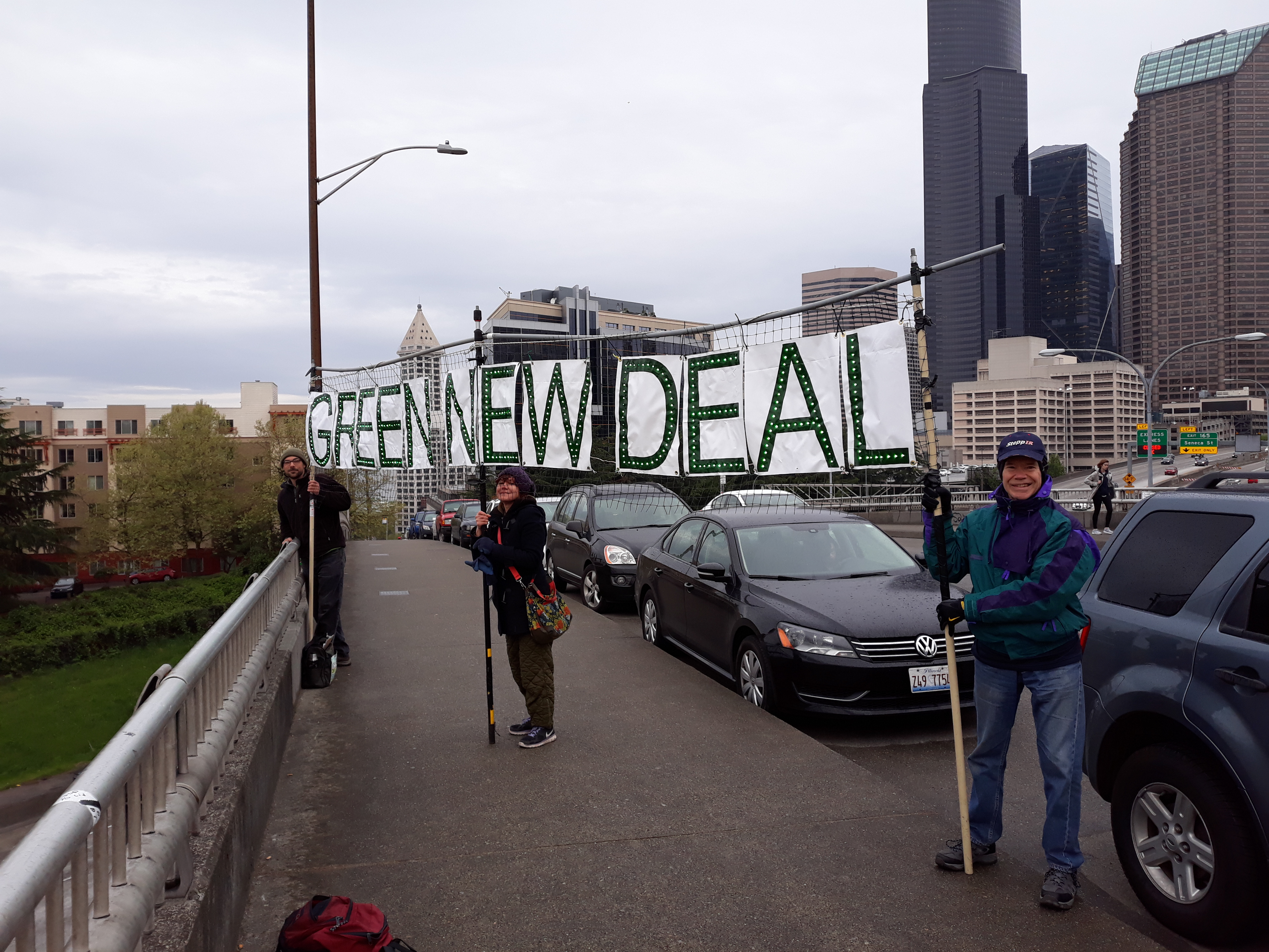 Seattle Earth Day Green New Deal highway bannering