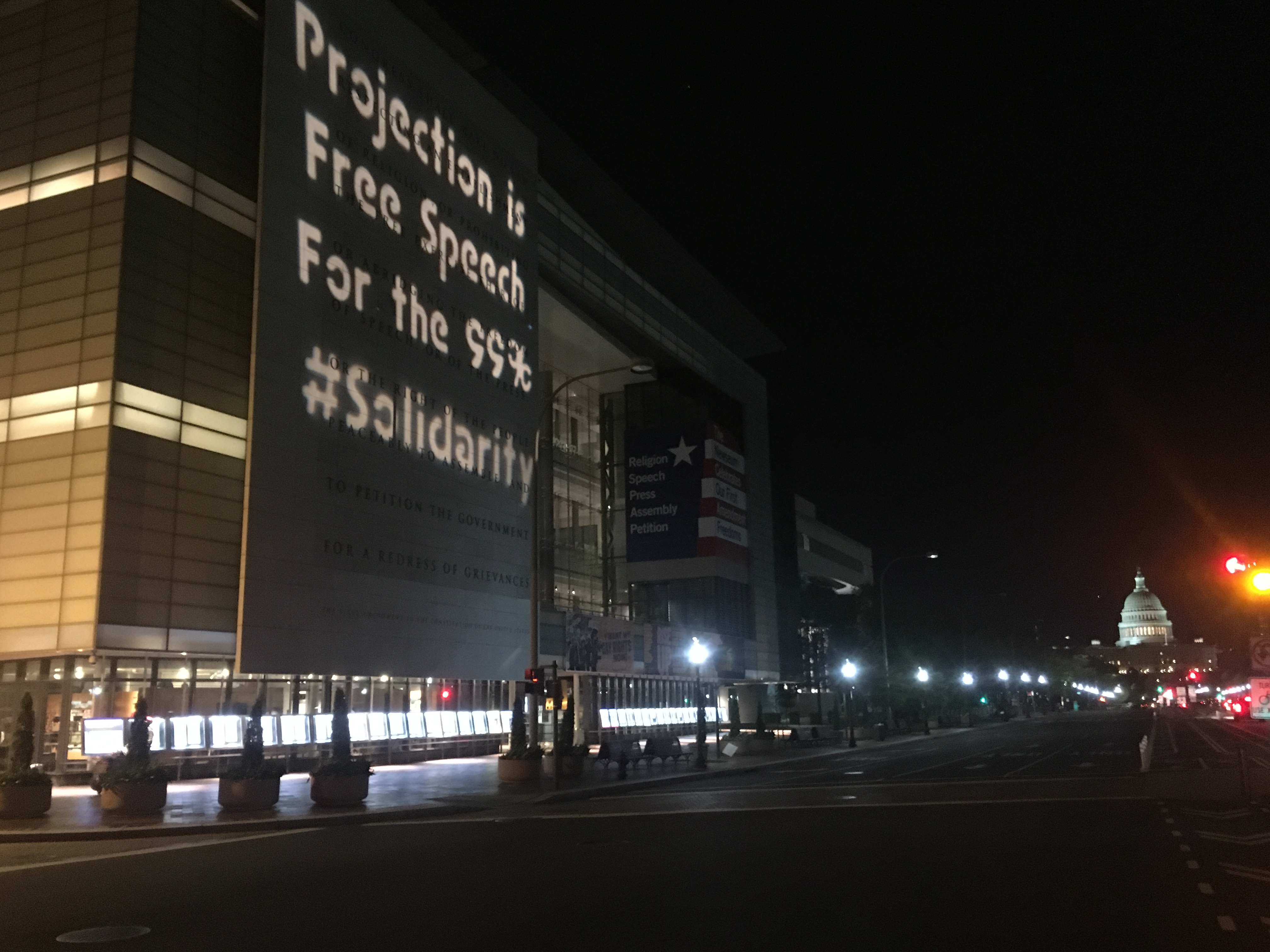 D.C. shines messages of solidarity for arrested projectionist