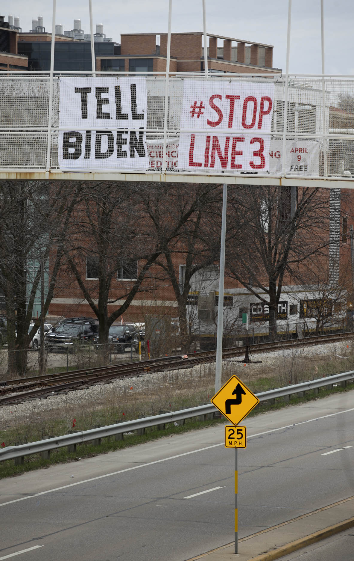 Commuters catch the Stop Line 3 Banner in Madison 