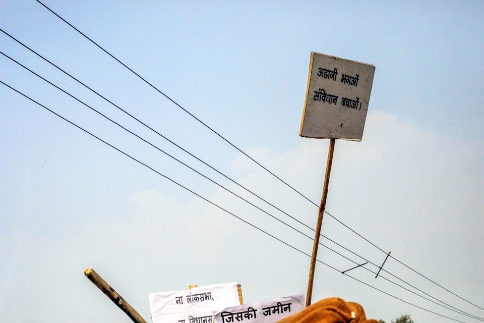 A banner reads: ‘Chase away Adani. Save the Constitution!’ Image by the author