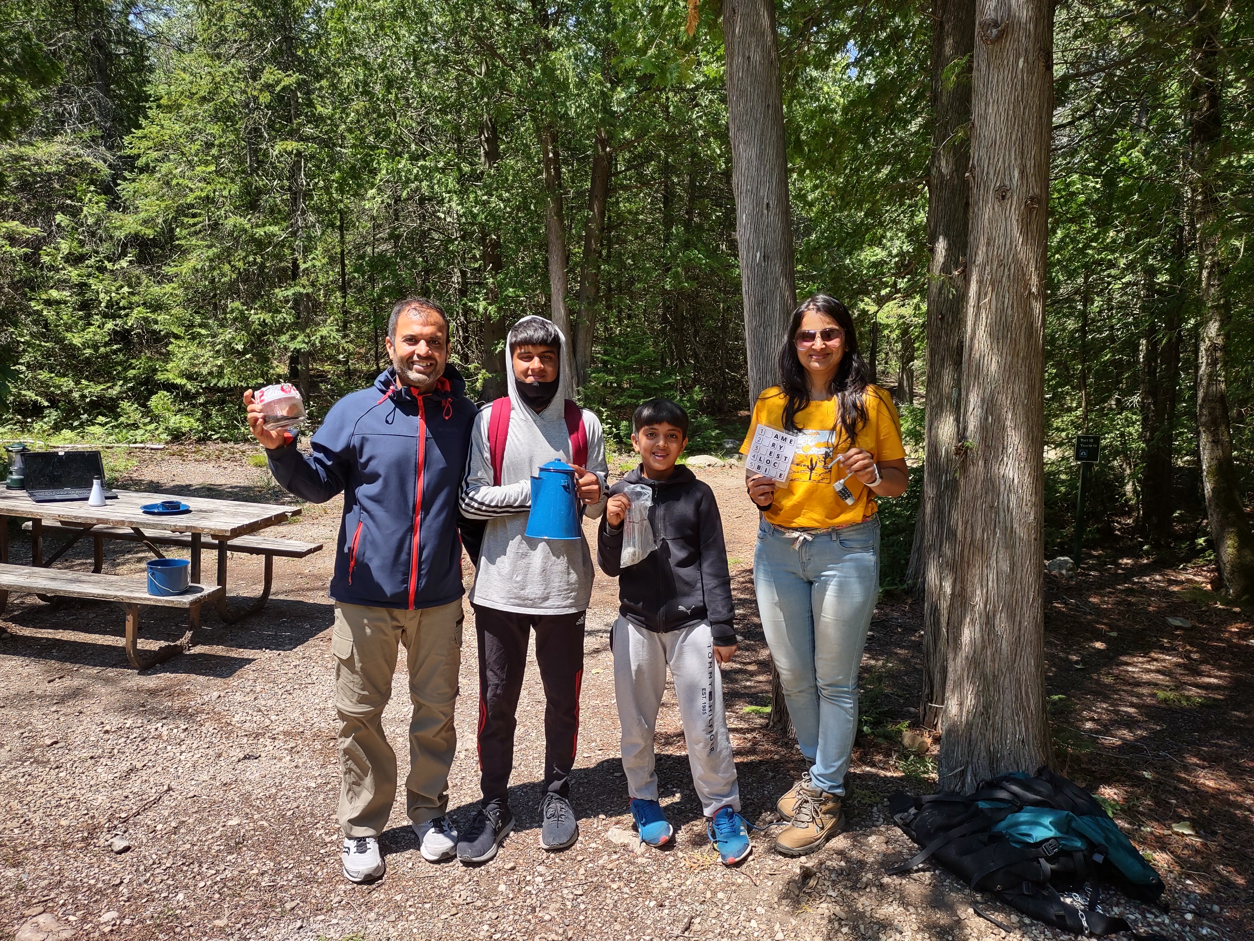 Family Cracking the Code During an Outdoor Escape Room with EcoAdventures