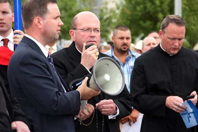 WichitaBishopKemmeHelpsLeadTheRosaryAtStFrancisOfAssisiInOkalahomCityForSatanicBlackMassProtest2014PhotoCourtesyOfKathyPetrAndDioceseOfWichita.jpg