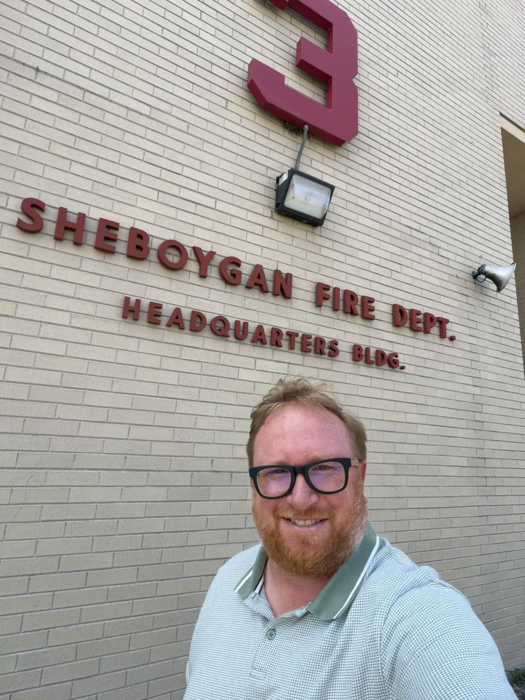 Selfie of Christian in front of the Sheboygan Fire Department
