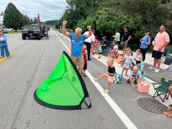 Cascade Fireman's Parade Young parade-goers kicking soccer balls into portable goals