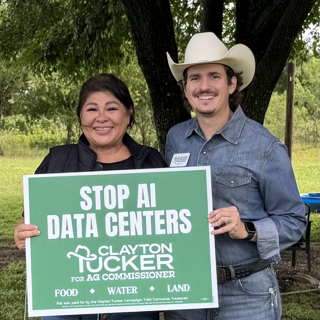 Clayton and a GOP candidate holding a \ Clayton and a GOP candidate holding a \