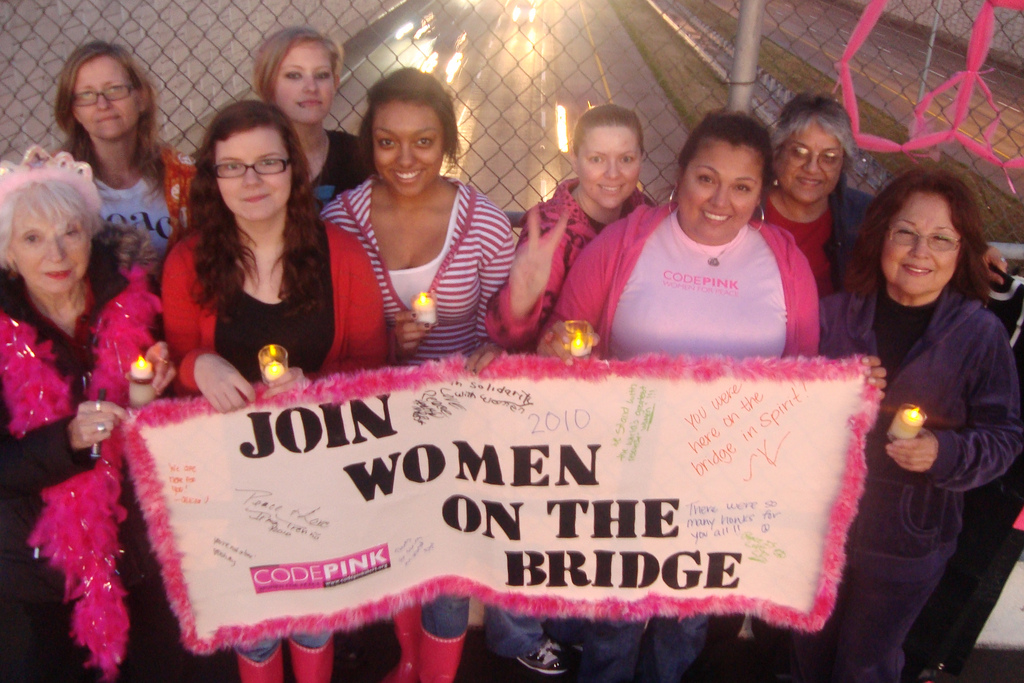 Women in Ft. Worth, Texas march for peace across an overpass bridge on International Womens Day, March 8, 2010