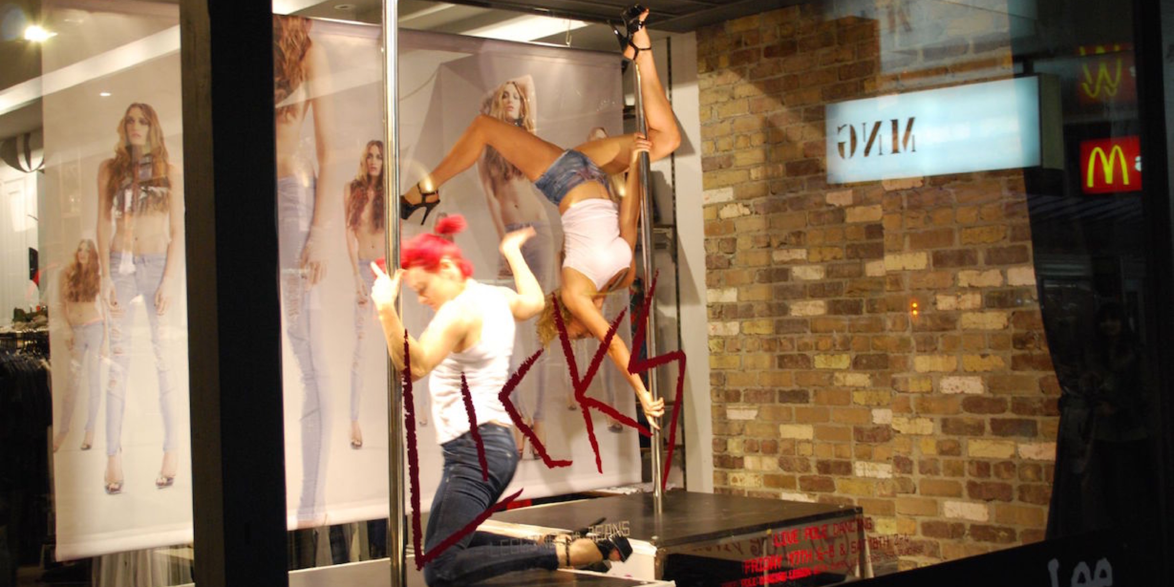 General Pants pole dancers in shop front windows