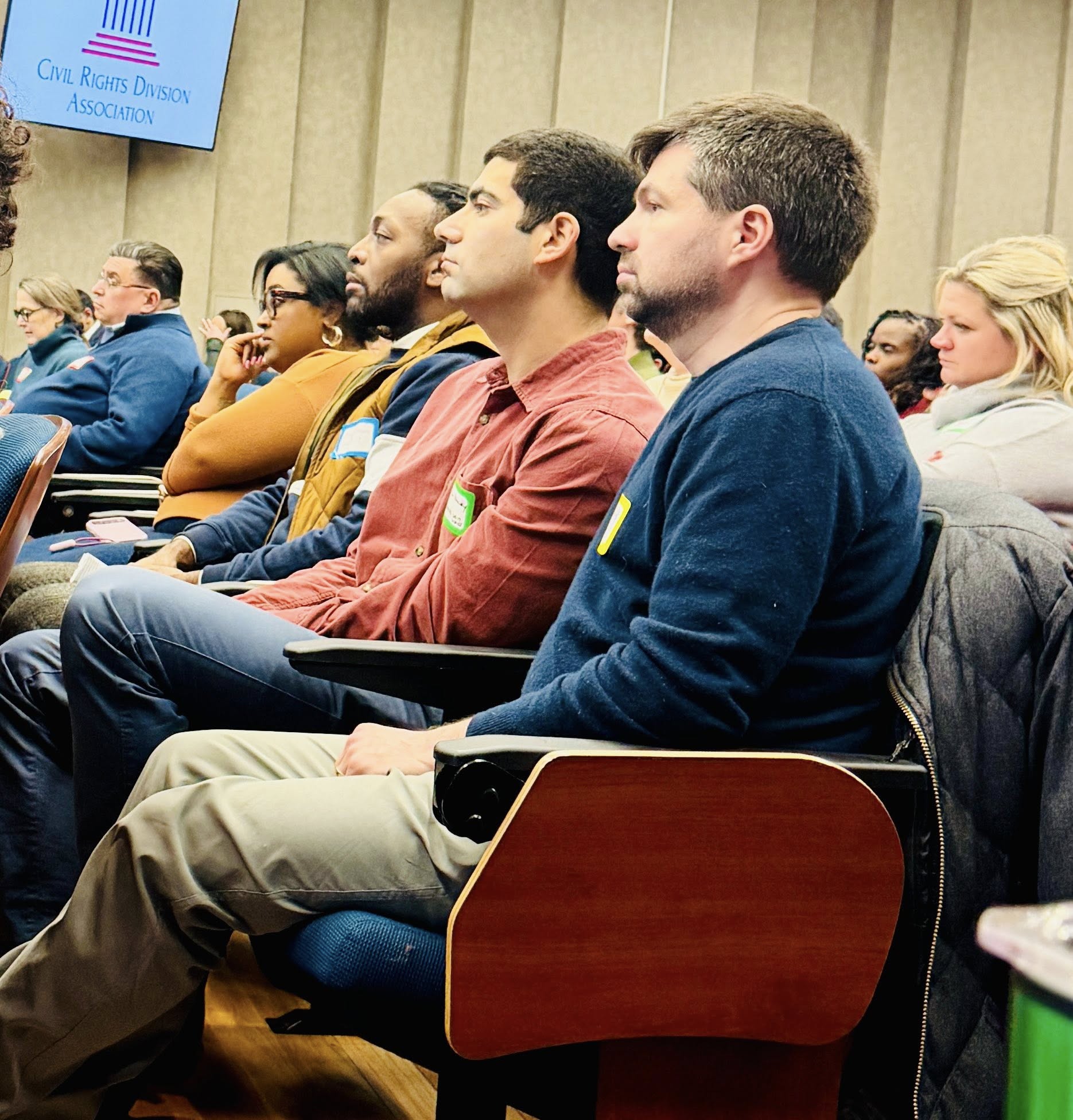Attendees Attendees watch the program with interest