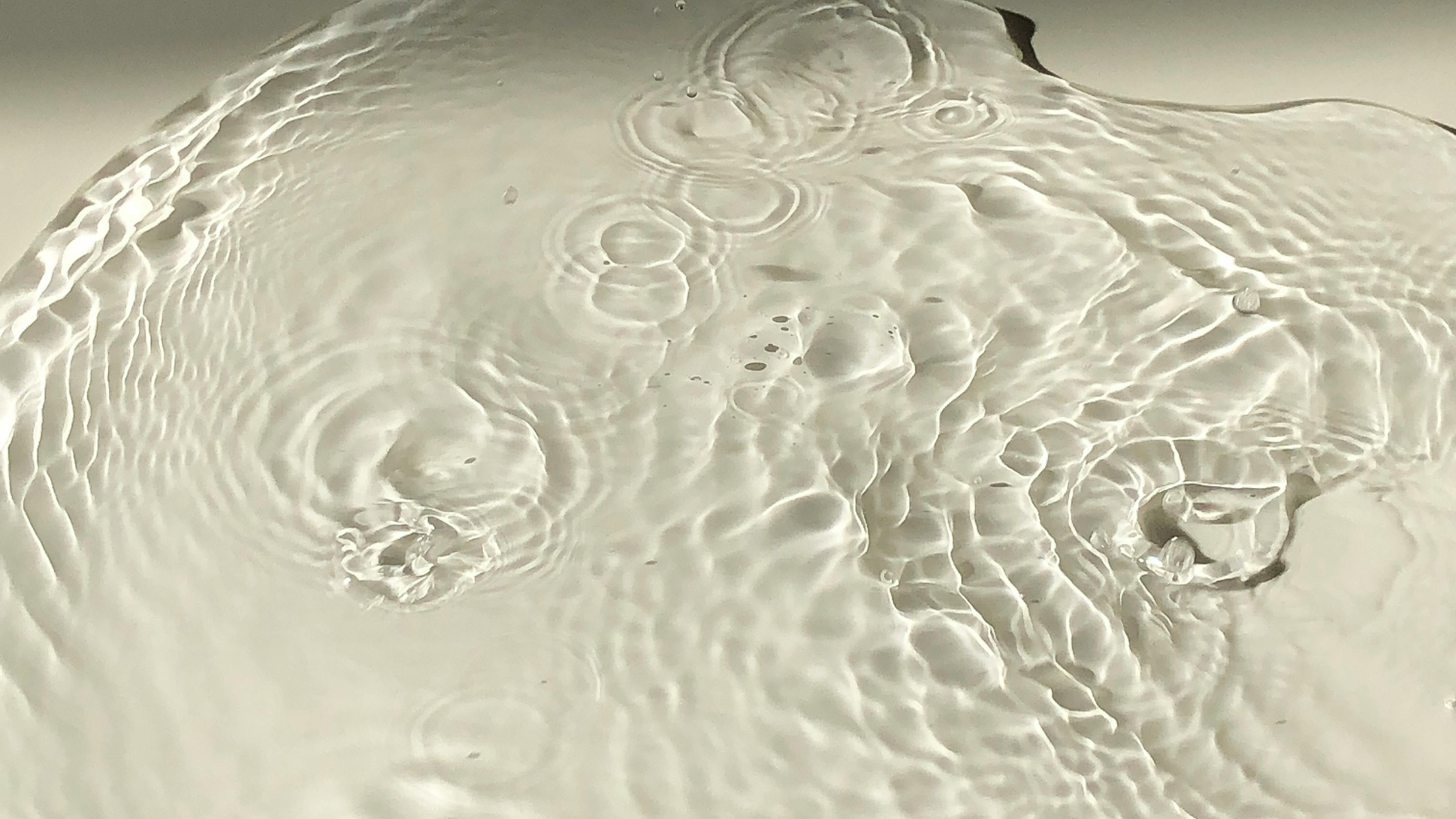 Ripples spreading from a shared source of water.