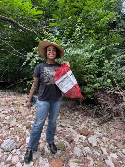 Volunteer picking up trash