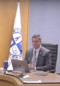 Dennis Hennen speaking at a council meeting.