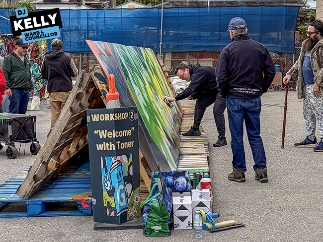 Img Alt: Cllr. D.J. Kelly lays some paint during the Greenview Industrial BIA's Graffiti Jam on Sept. 13, 2026. (Rukhsaar Daya / Ward 4)