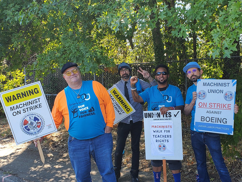 Drivers Union drivers standing with picket signs at the Portland Boeing factory in solidarity with striking Boeing workers.