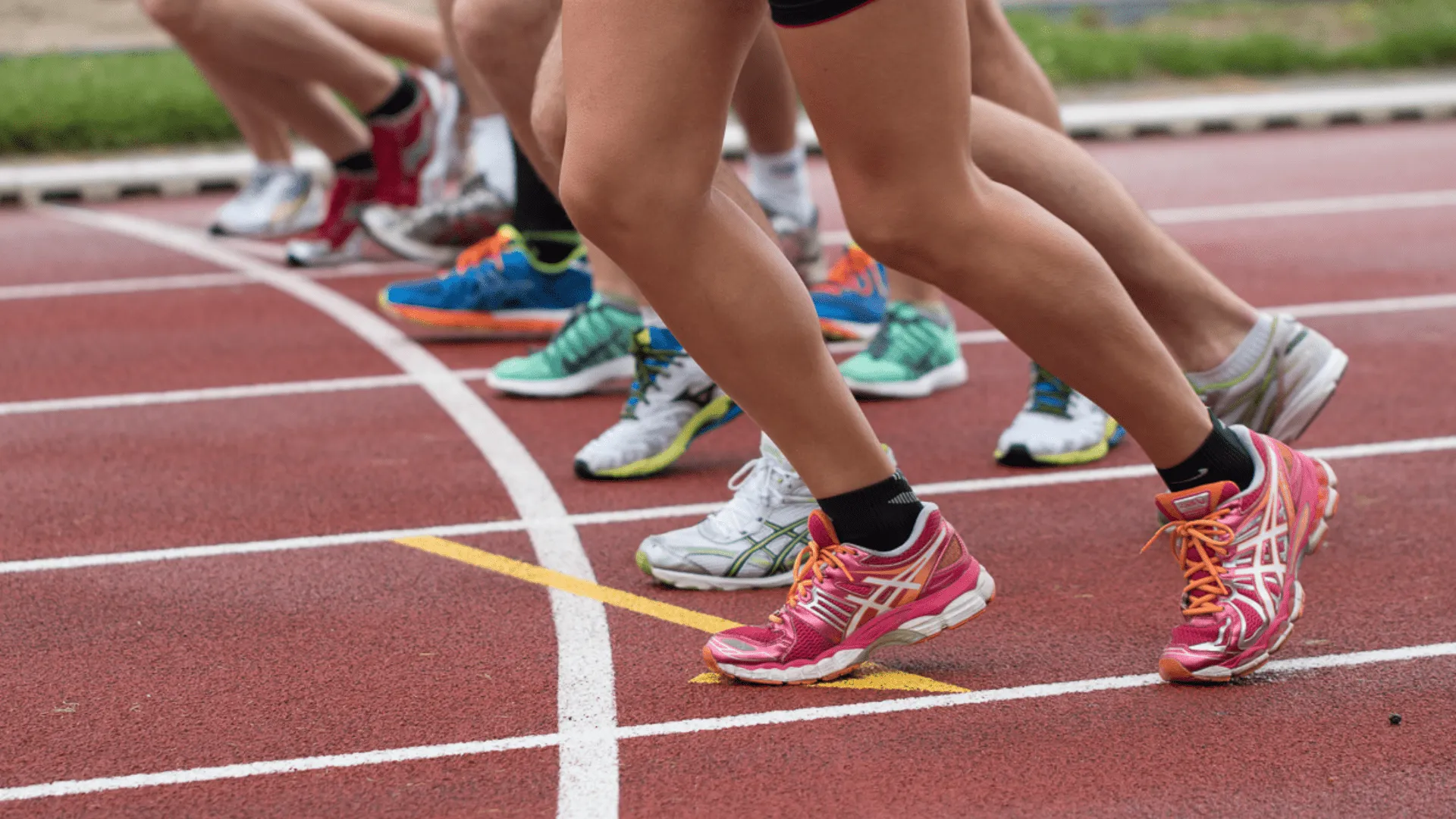 Group of athletes racing on a track