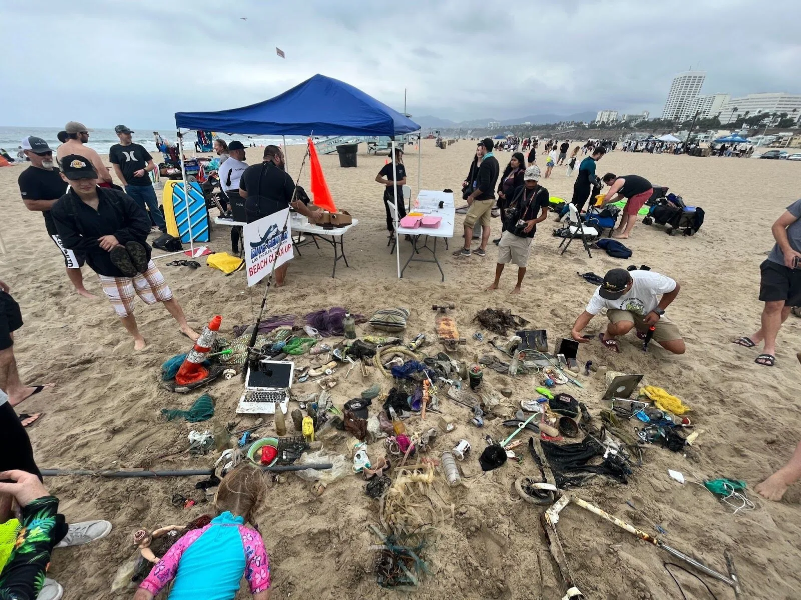 Over-head picture of a polluted beach cleanup