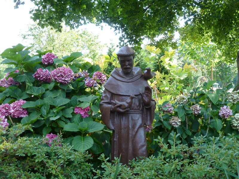 picture of a religious statue in a garden