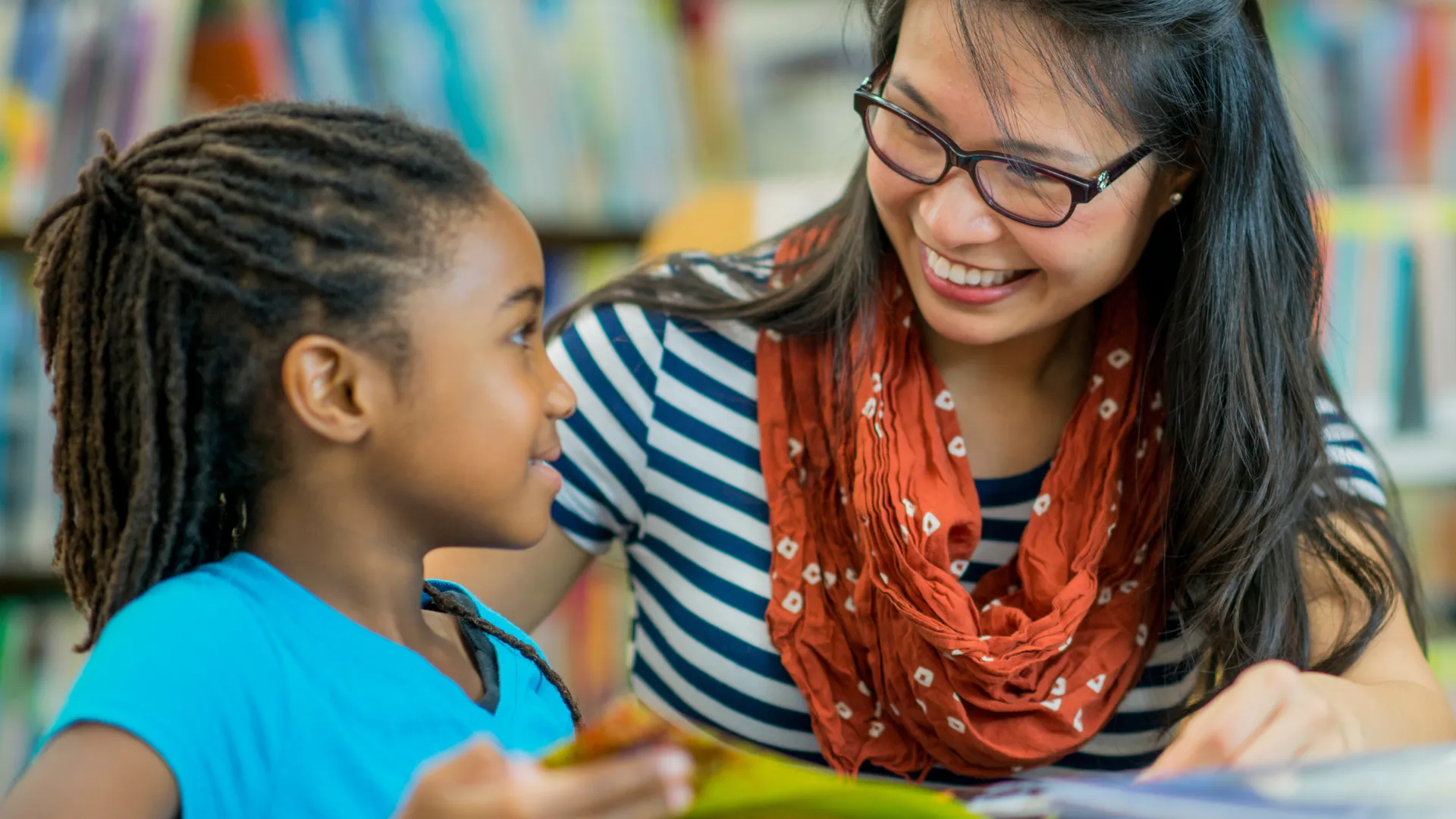 Picture of a teacher helping a kid