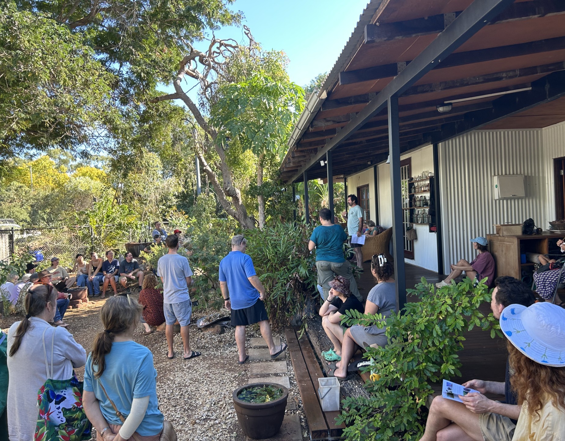 Native garden enthusiasts among the swales listen to tips on harvesting water. Photo by Kylie Weatherall.