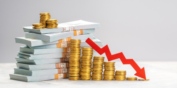 stack of money with arrow going down