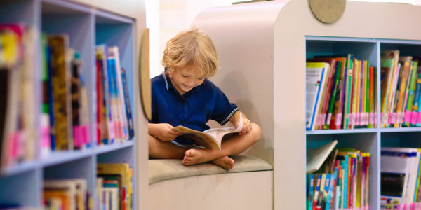 classroom library child reading in classroom library