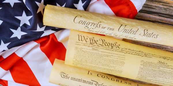 american flag with declaration of independence on top