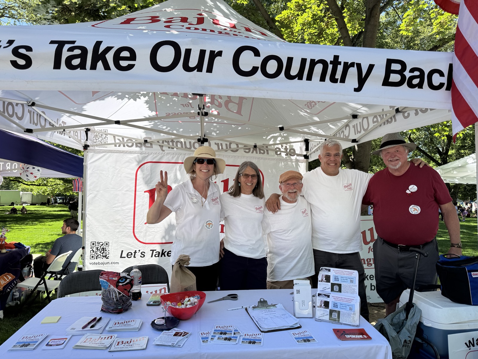 Bajun Mavalwalla, campaign volunteers, and supporters gather at the Bajun for Congress booth during the Union-Bulletin's 4th of July in the Park celebration in Walla Walla.