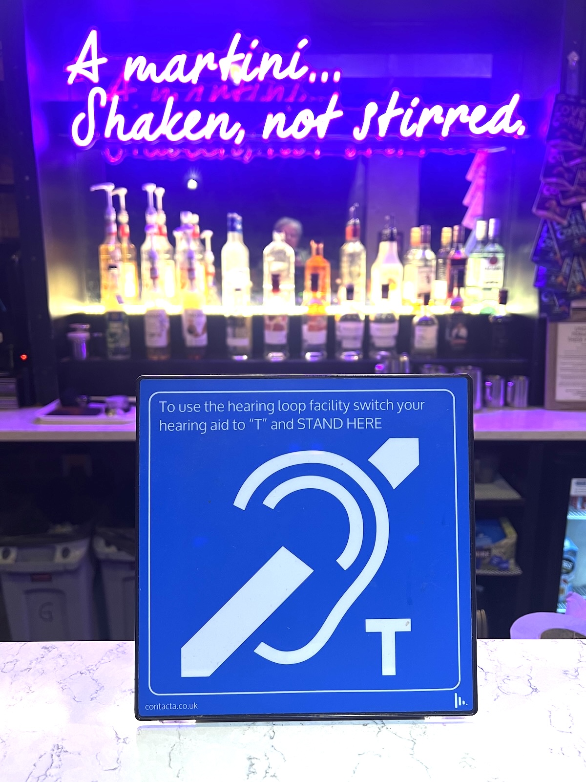Montrose Playhouse hearing loop sign A sign on the bar in the Montrose Playhouse cafe with instructions on how to turn on hearing loop devices.