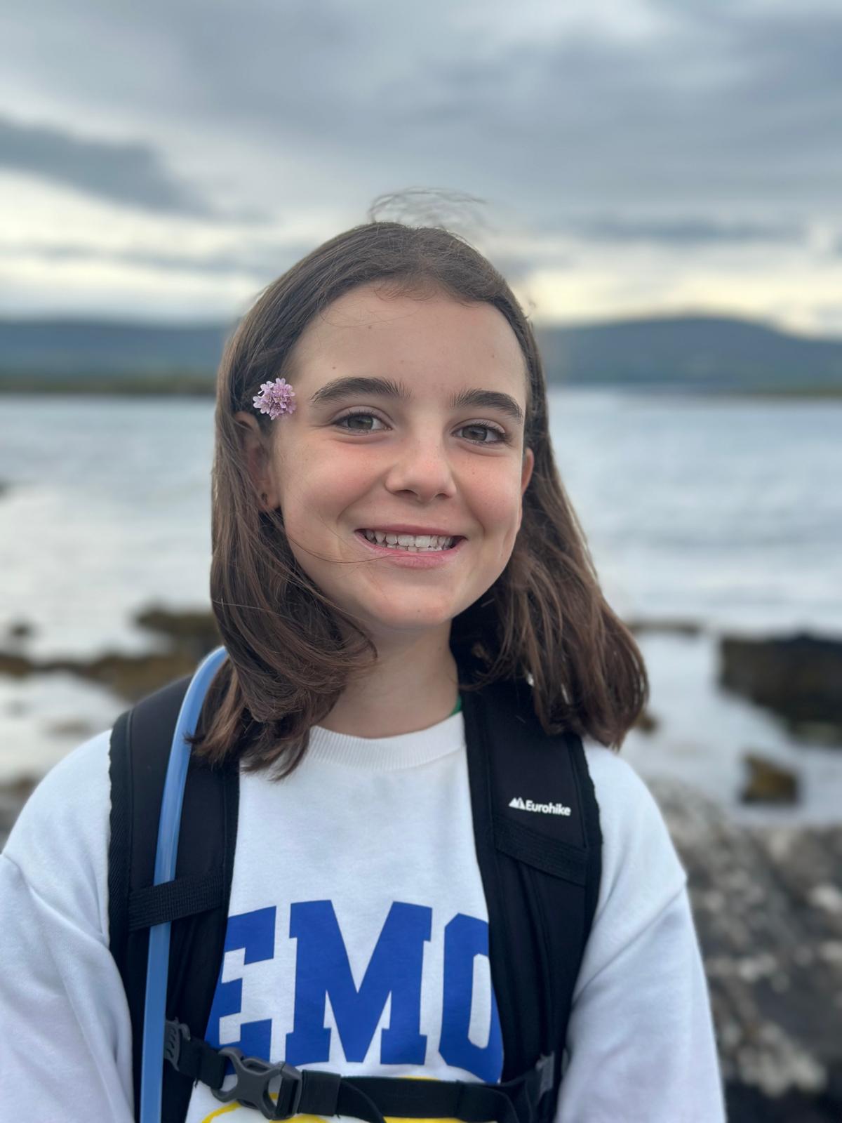 A young girl with long brown hair.