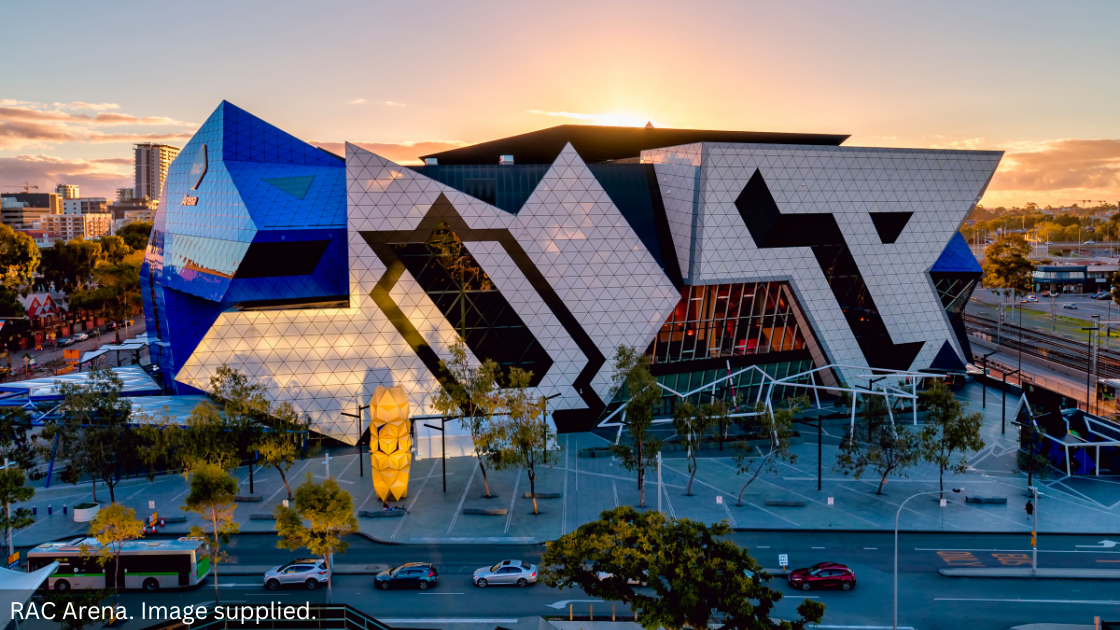 RAC Arena with a sunset behind it.