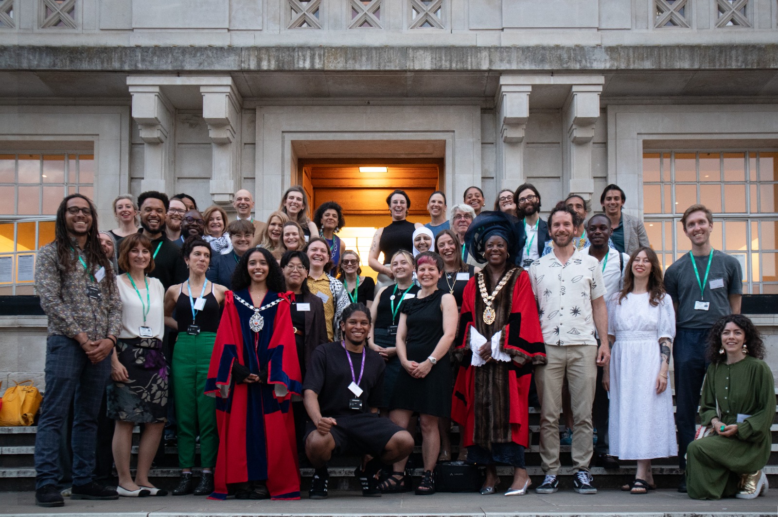 Image of around 40 new Green Councillors, the Mayor of Hackney and the Speaker and Deputy Speaker in red robes, on the steps in front of Hackney Town Hall.