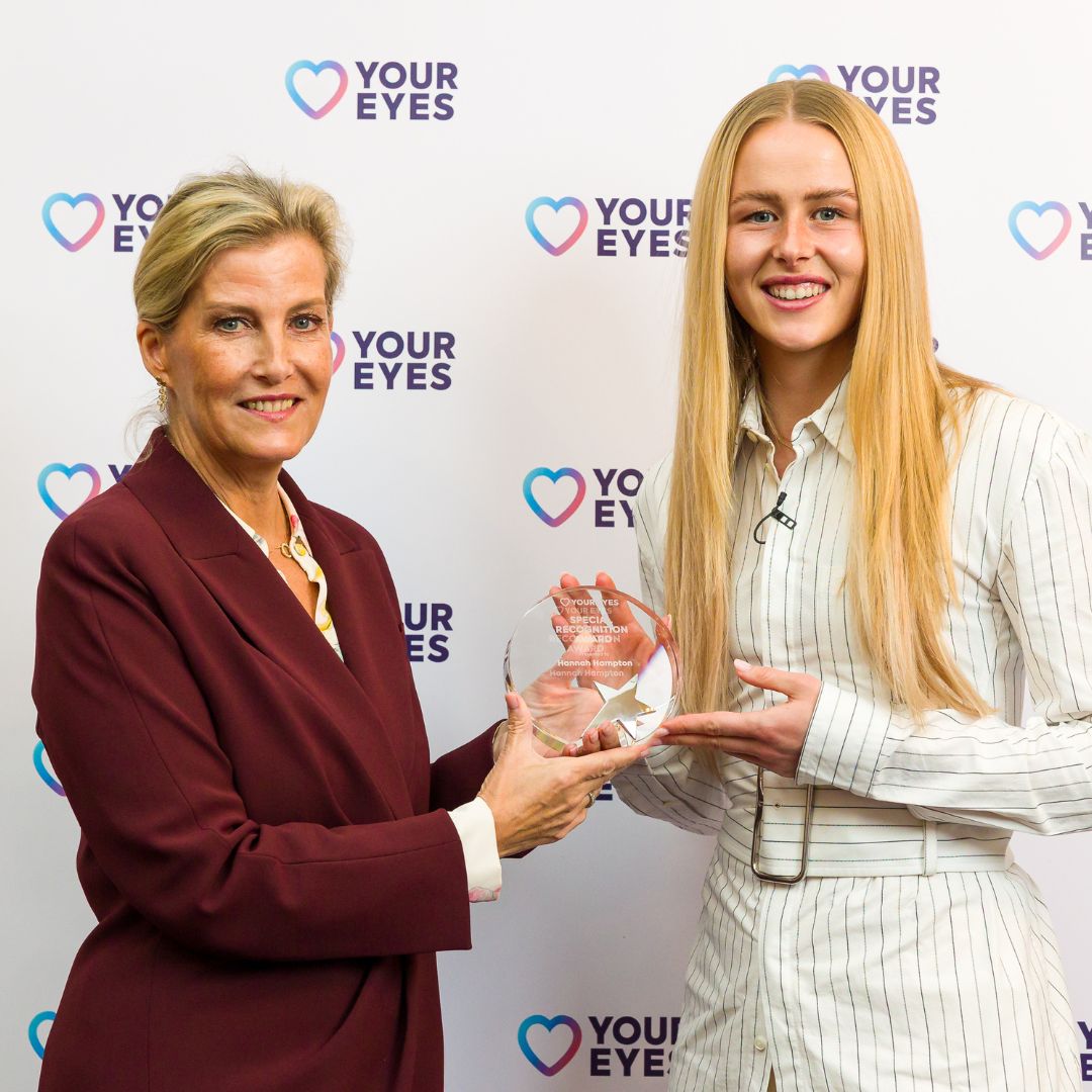 The Duchess of Edinburgh and Hannah Hampton
smile at the camera. She holds the mascot for CBeebies.