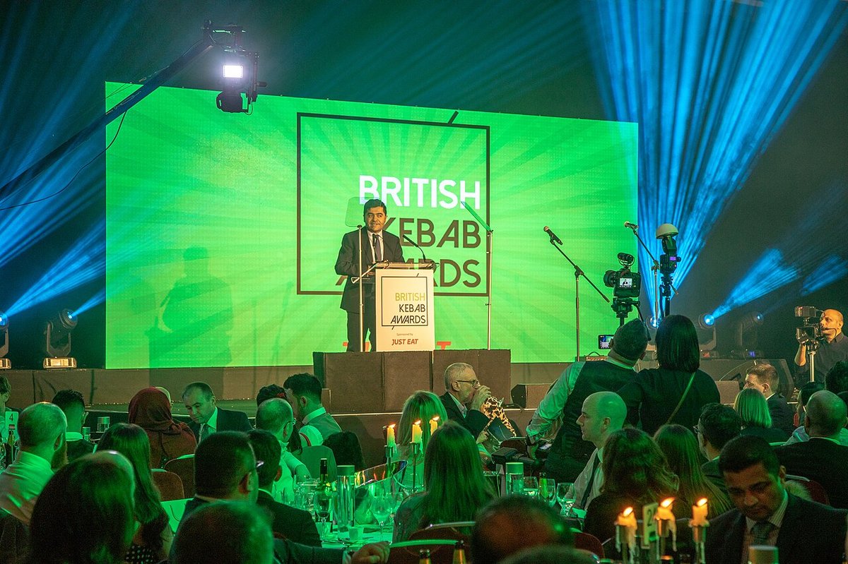 Ibrahim Dogus on stage at the British Kebab Awards