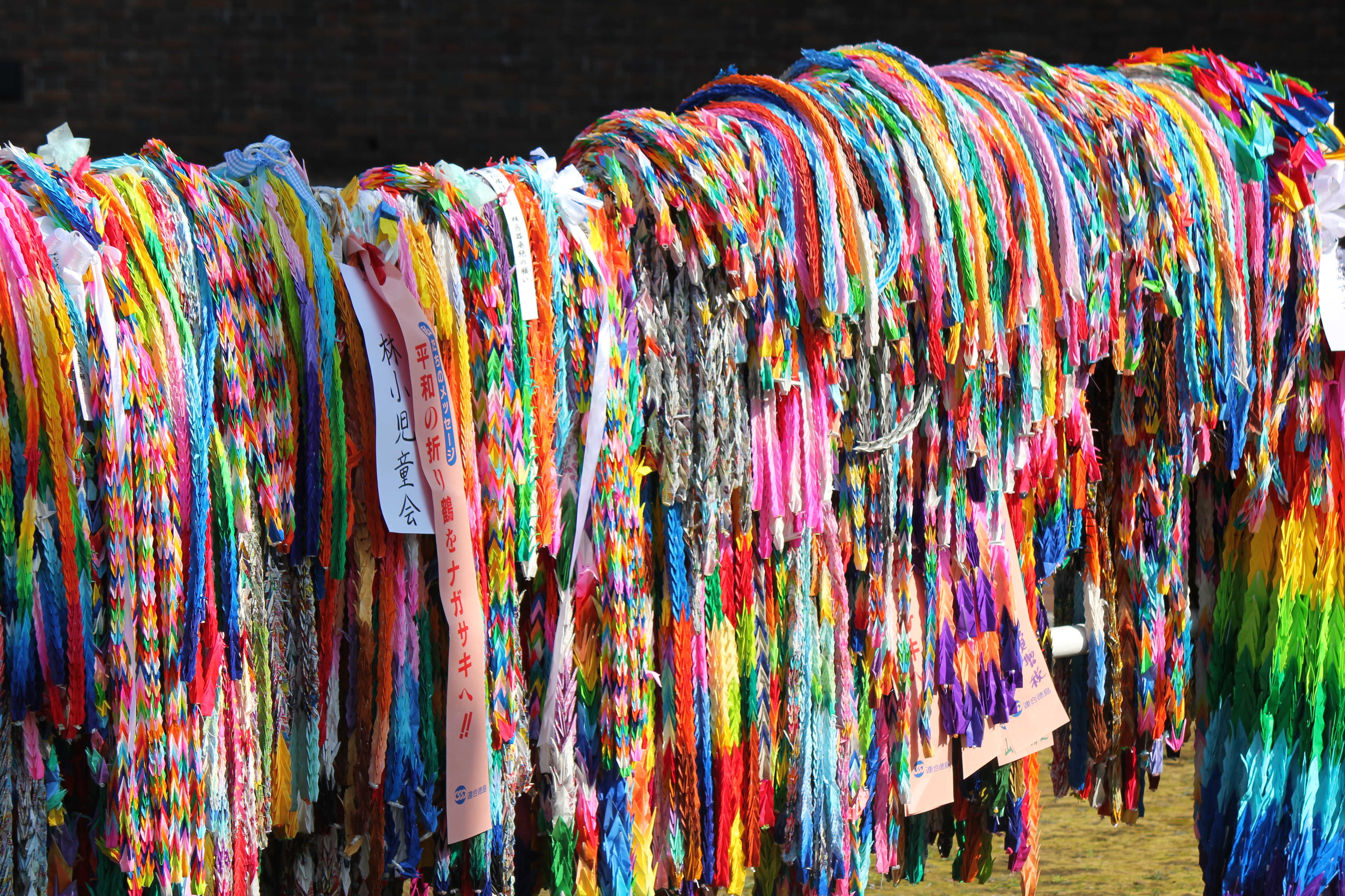 Thousands of paper cranes adorning a monument in Nagasaki. Credit: ICAN