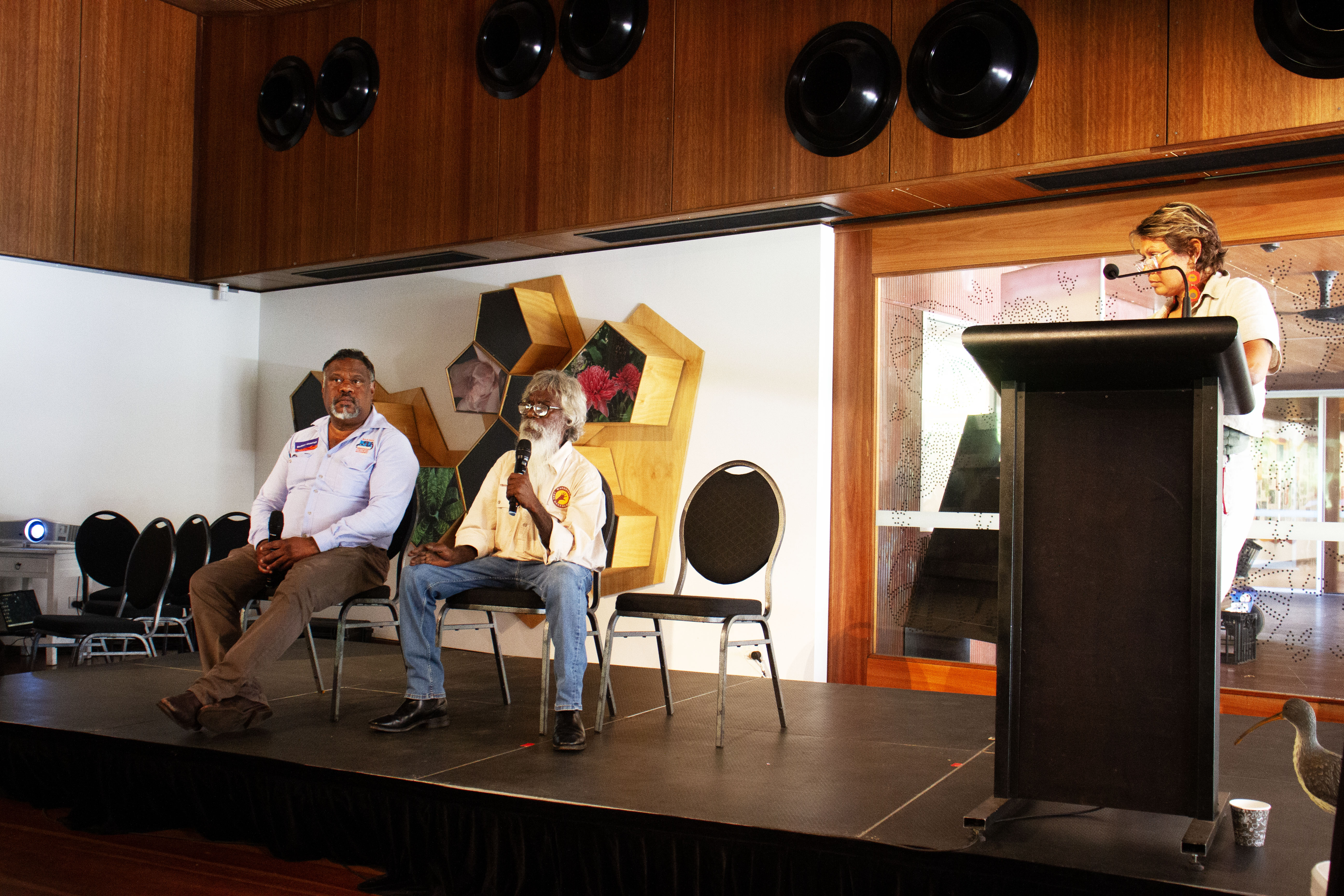 Dr Dean Yibarbuk, Barry Hunter and Cissy Gore-Birch discussing hybrid economic futures at the Great Northern Conference. (Image: supplied, ECNT) Dr Dean Yibarbuk, Barry Hunter and Cissy Gore-Birch discussing hybrid economic futures at the Great Northern Conference. (Image: supplied, ECNT)