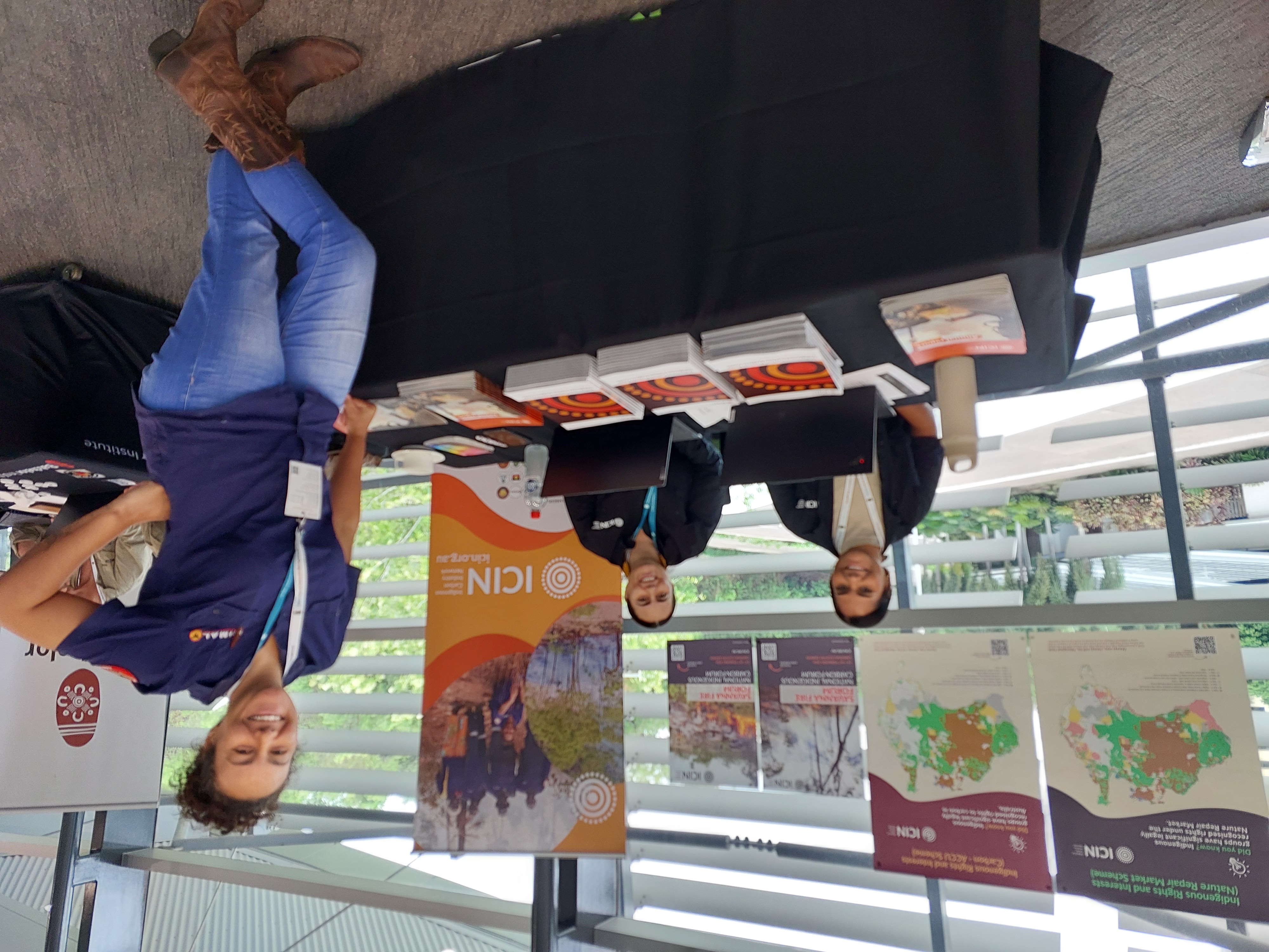 ICIN's Suzanne Munkara and Amanda Lilleyman answering questions at the ICIN booth