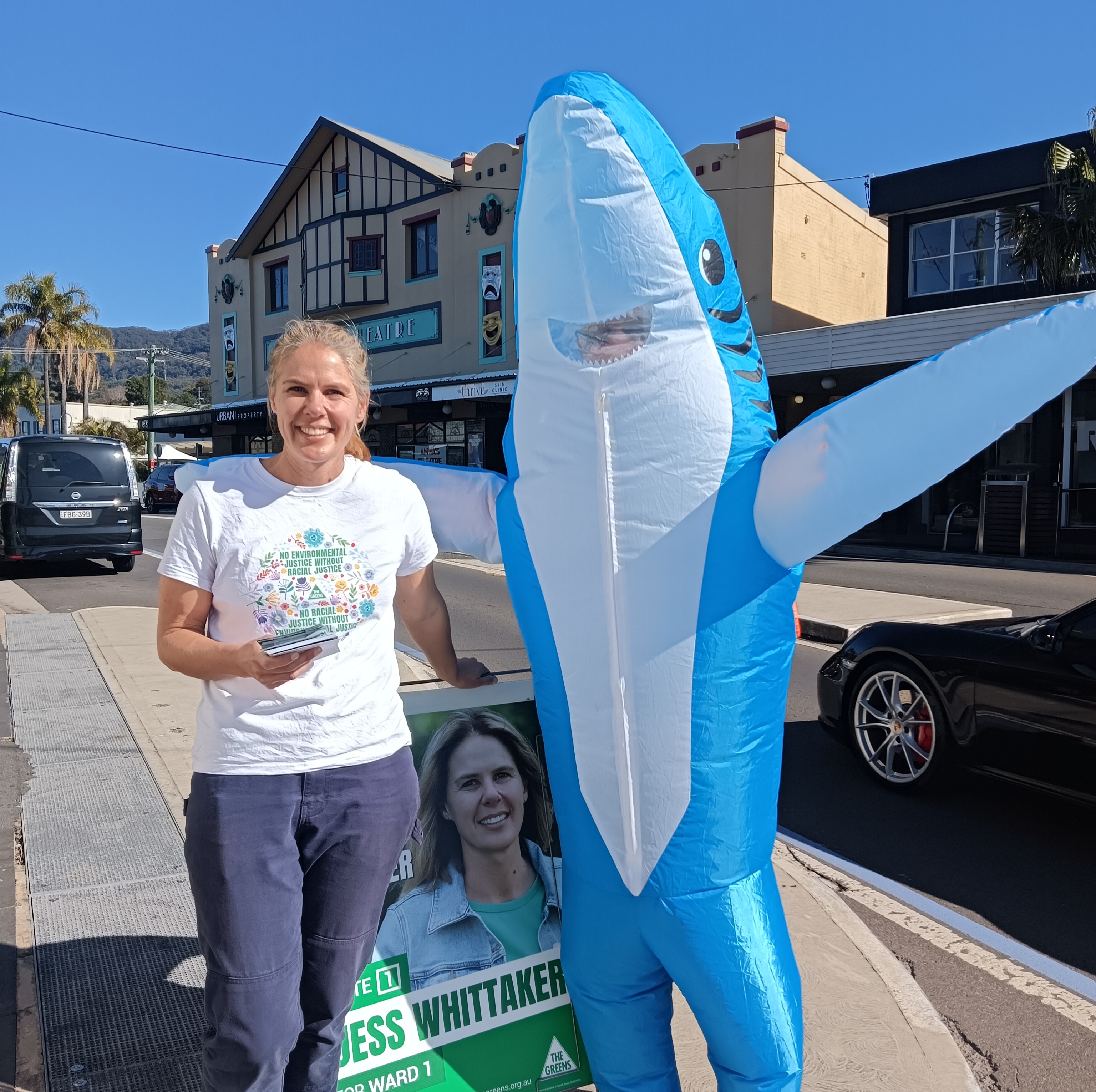 Councillor Whittaker and a person wearing a shark costume, in Thirroul near Anita's theatre.
