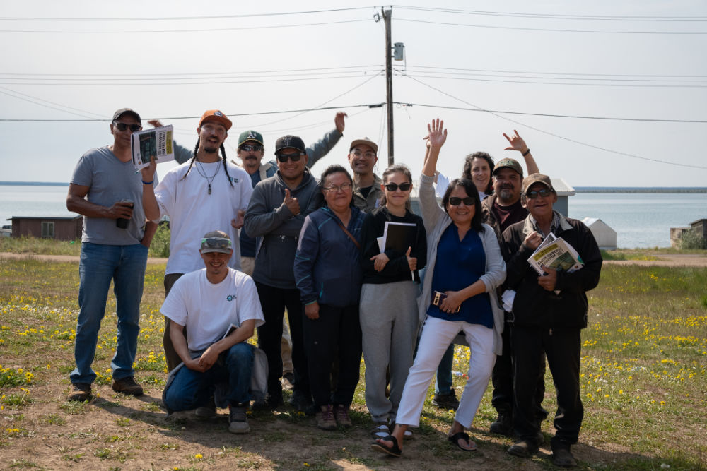 I&E trainees and cabin owners of a new off-grid solar energy system - Introduction to Solar PV systems training program, delivered in collaboration with Gonezu Energy, Délı̨nę, NWT, 2024