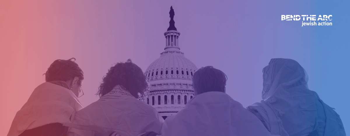 Jews wearing tallit with arms wrapped around
each other in front of the Capitol Building