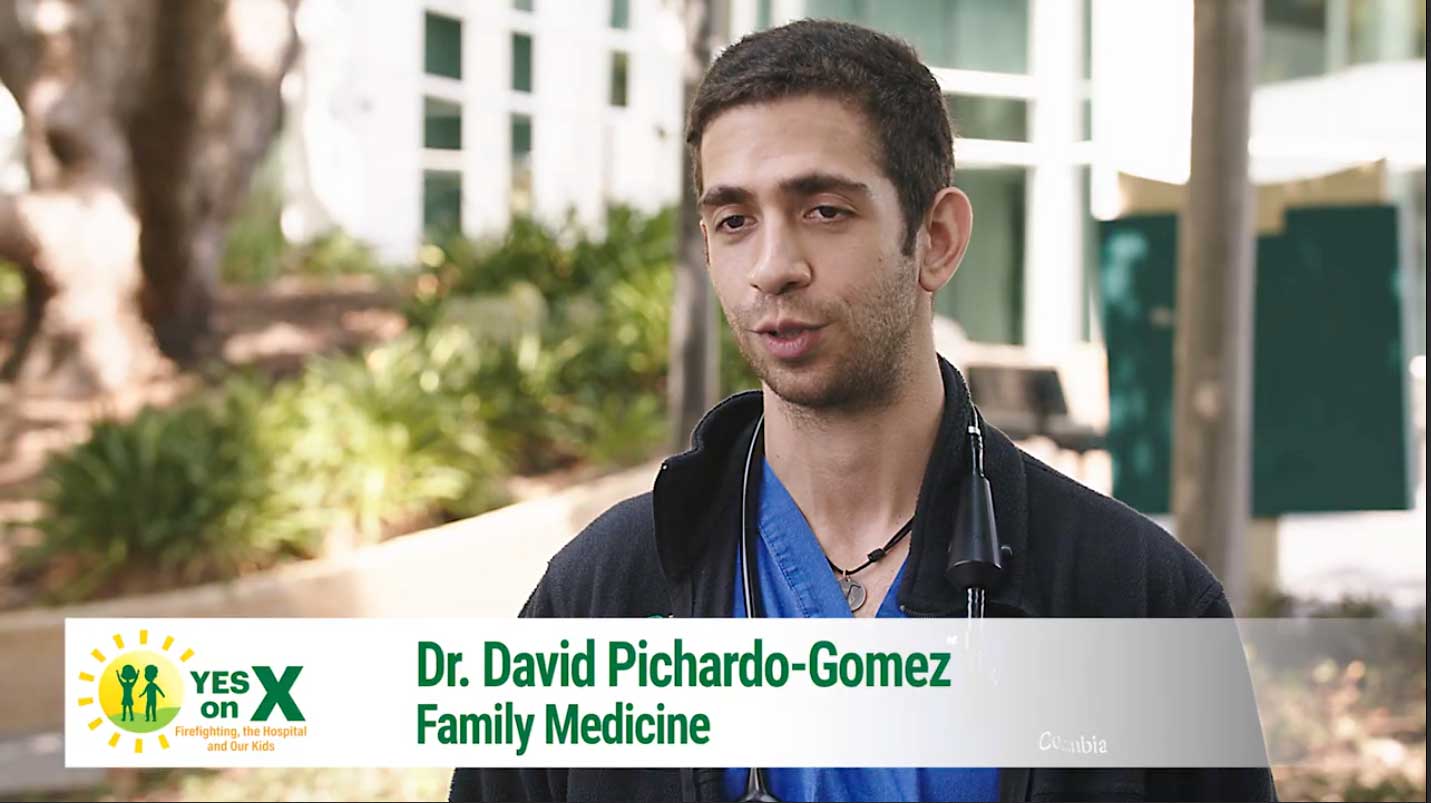 Dr. David Pichardo-Gomez, a family medicine physician, speaking outdoors in support of Measure X to fund essential services in Contra Costa County.