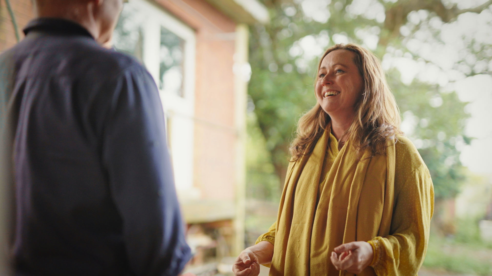 Kate talking to community member