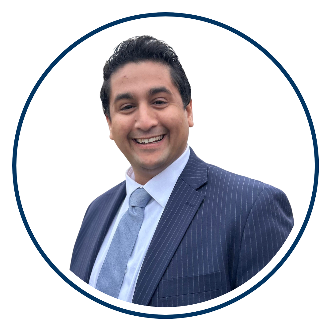 Latino male with dark hair wearing a Blue blazer and white shirt