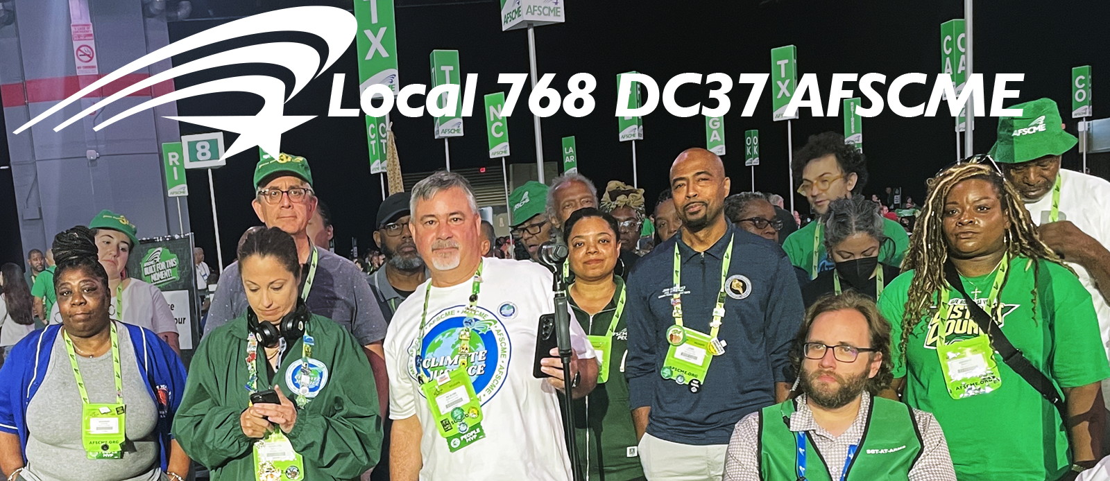 Image of DC37 members with their banner marching on May 1 in NYC