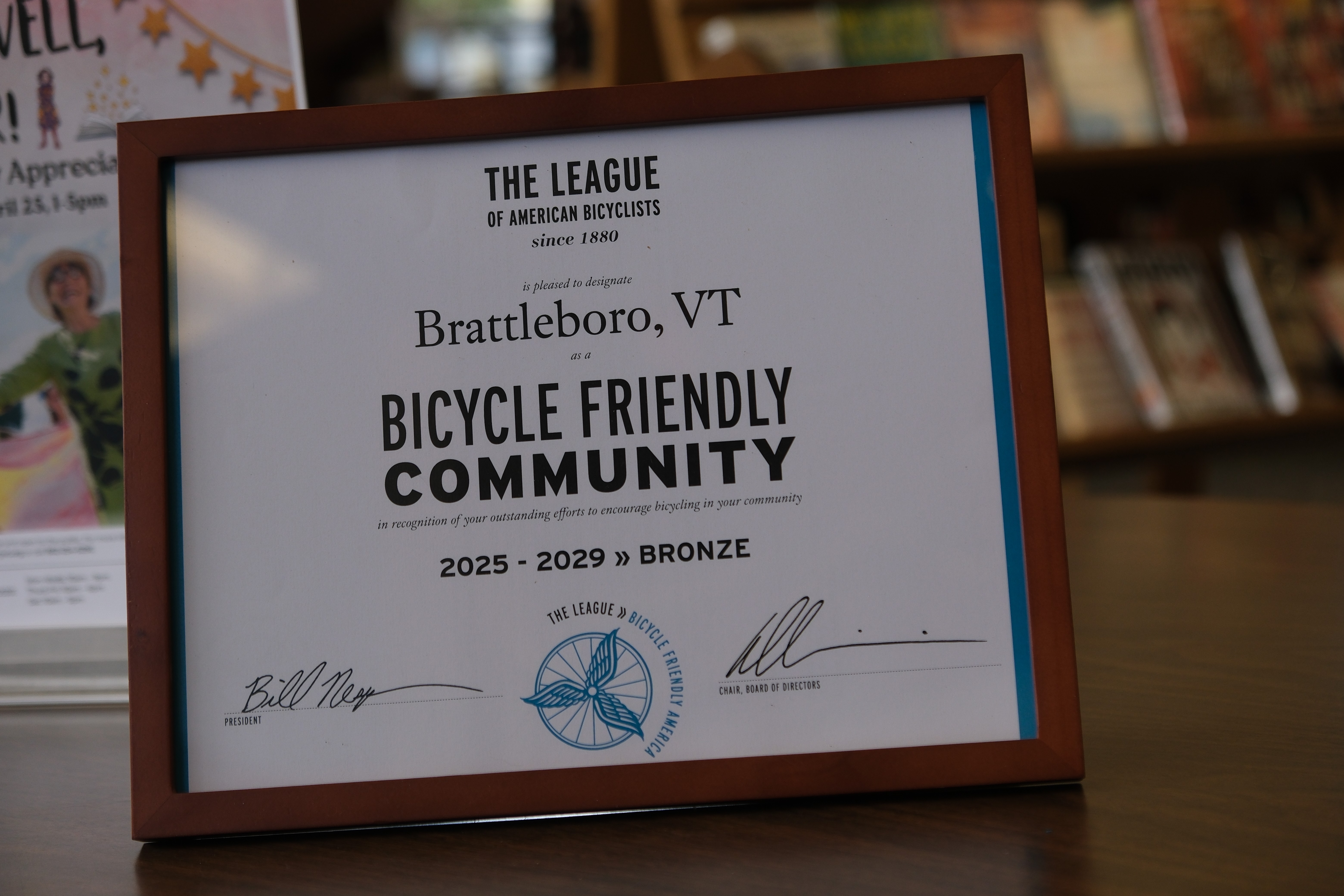 closeup of the framed award which reads Brattleboro, VT Bicycle Friendly Community 2025-2029 bronze